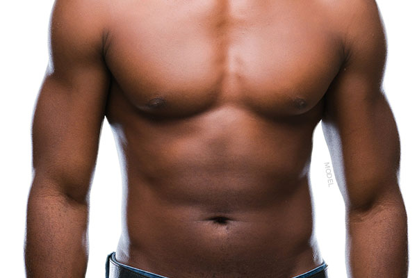 Mid body shot of a muscular male model with defined abdomens