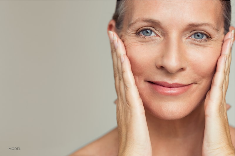 middle age woman following a cosmetic face procedure.