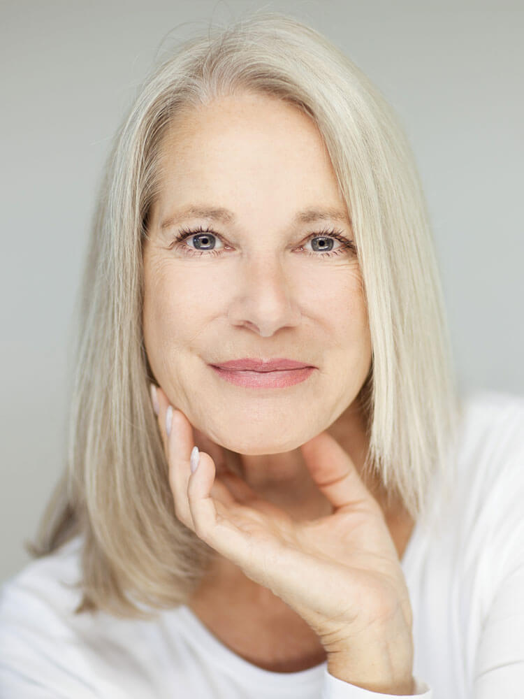 Woman posing and grabbing her chin