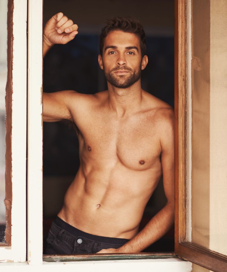 Man leaning against window