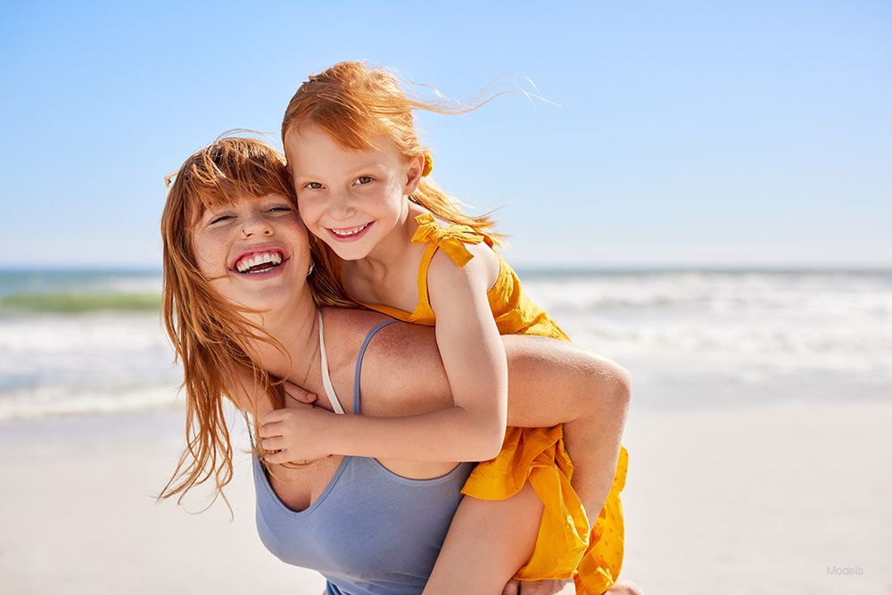 Woman and child at the beach